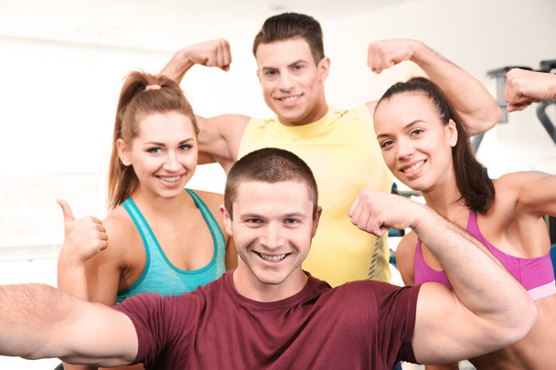 Group of people taking selfie in gym - Photo, Image