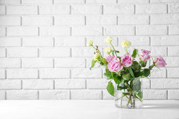 Glass vase with bouquet of flowers - Fotó, kép