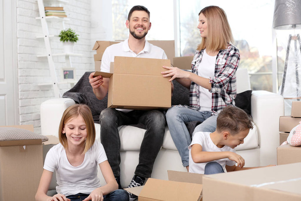 Happy family unpacking boxes  - Foto, immagini