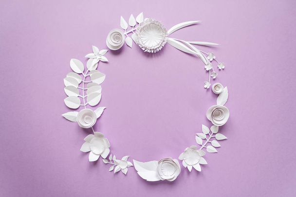 round frame with paper flowers on the purple background - 写真・画像