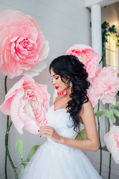 Portrait of a beautiful fashion bride, sweet and sensual. Wedding make up and hair. Flowers background - Valokuva, kuva