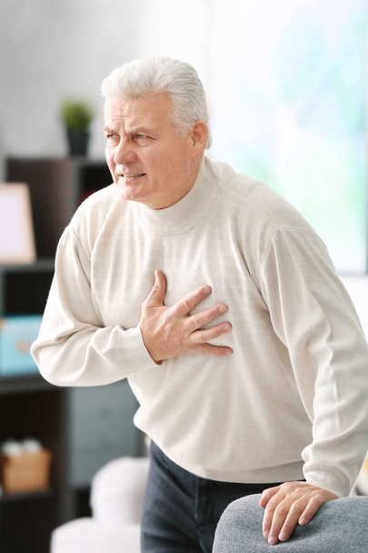 Aged man having heart pain  - Foto, Imagen