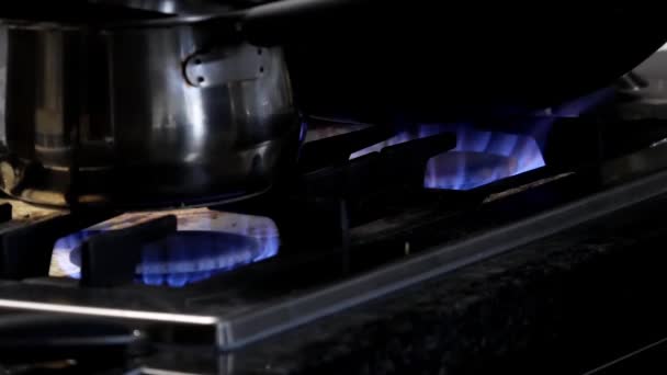 Motion of stainless steel pot on gas oven - Footage, Video