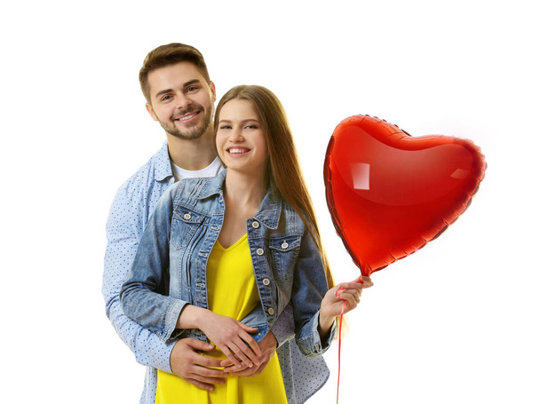 young couple with balloon in shape of heart  - Fotoğraf, Görsel