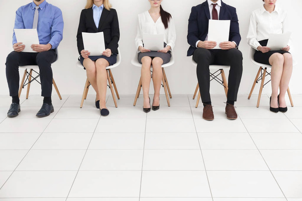 Group of people holding papers and  waiting for job interview  - 写真・画像