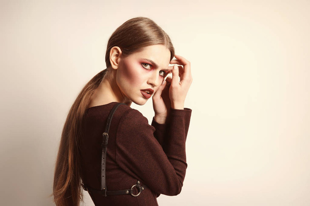 Young model with creative makeup - Фото, изображение