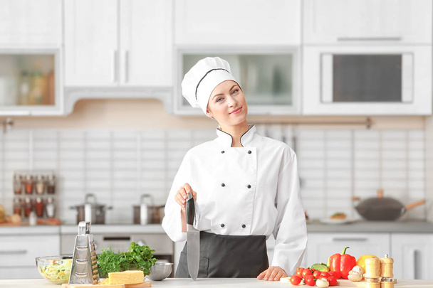 young female chef in kitchen - 写真・画像