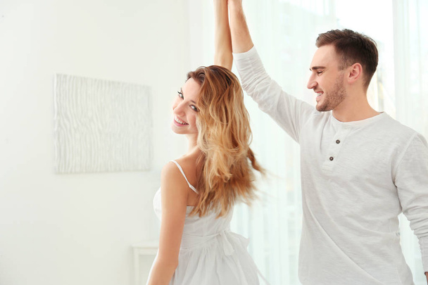 young couple dancing at home - Photo, Image