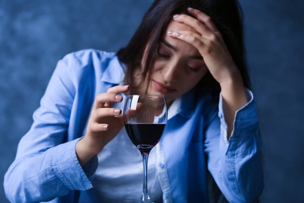 Depressed young woman drinking  - Фото, зображення