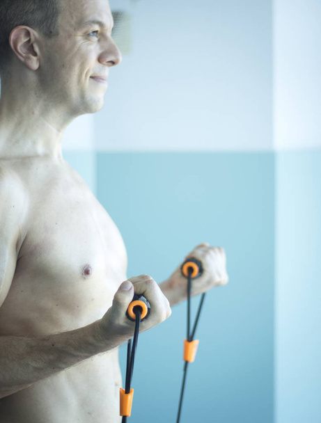 Man exercising with exercise bands - Photo, Image