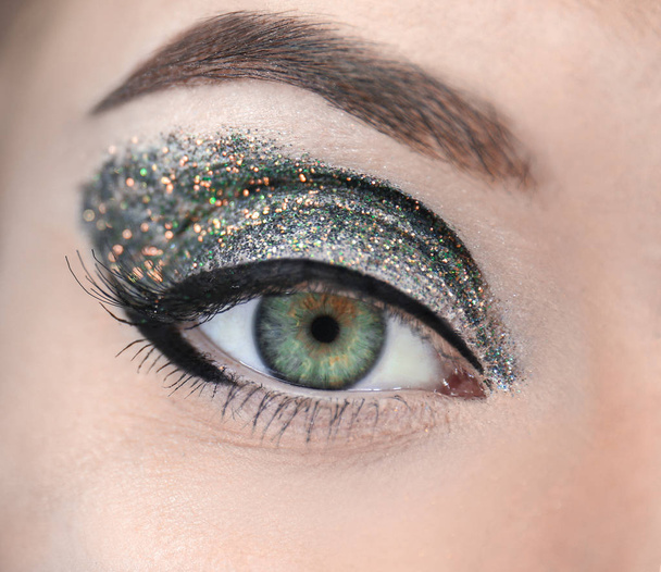 Female eye with fancy makeup - Valokuva, kuva