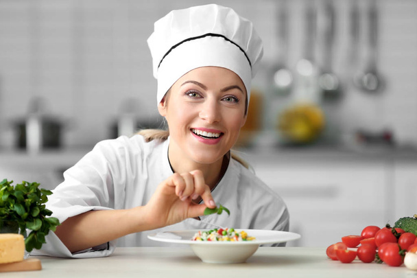 Female chef in kitchen - Fotó, kép