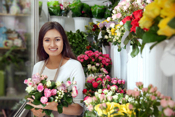 Pretty young florist - Фото, зображення