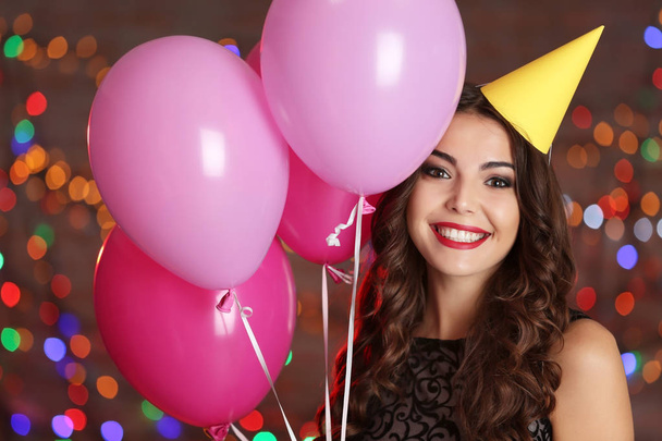 young woman with colorful balloons - Foto, Bild