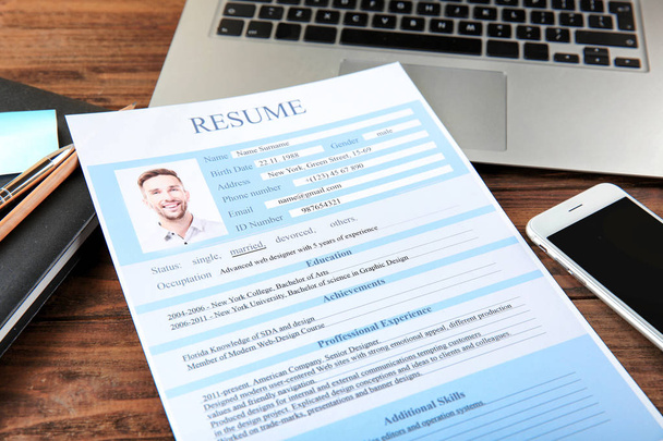 Resume on wooden table - Photo, Image