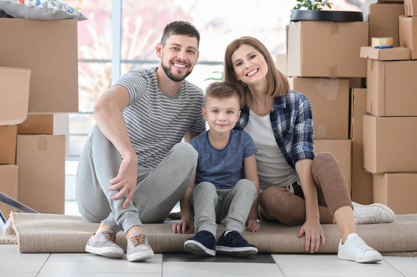 Young family sitting on floor  - Photo, image