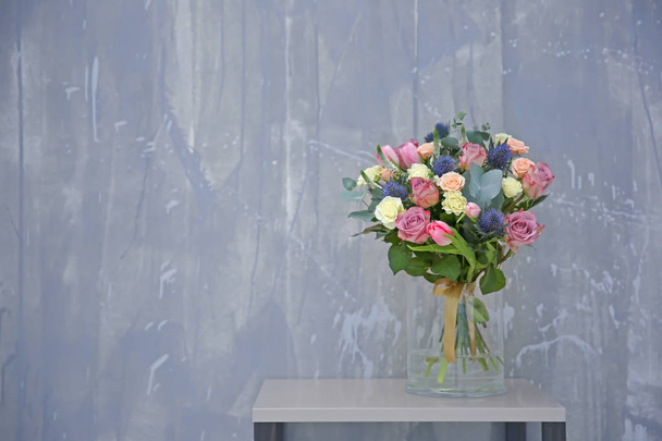 Glass vase with beautiful bouquet - 写真・画像