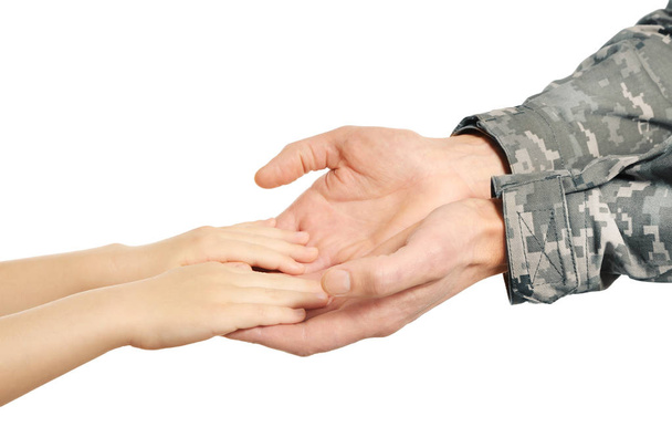 Hands of soldier and child   - Foto, Bild