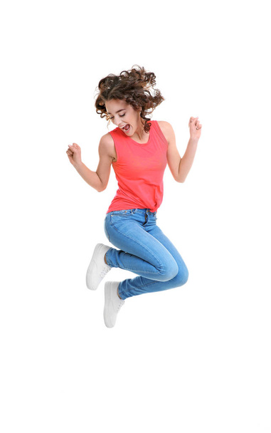 Joyful young woman jumping   - Foto, imagen