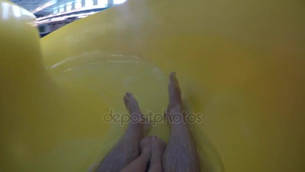 Boy and father go down water slide - Footage, Video