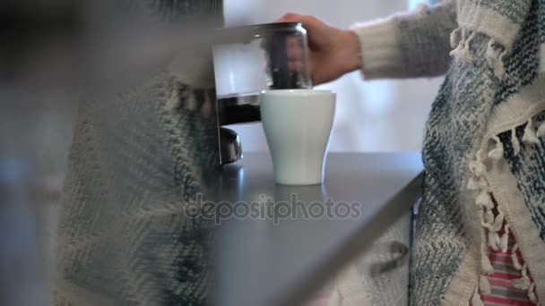 Happy woman drinking coffee in the kitchen and smiling at camera. Slow Motion. - Imágenes, Vídeo