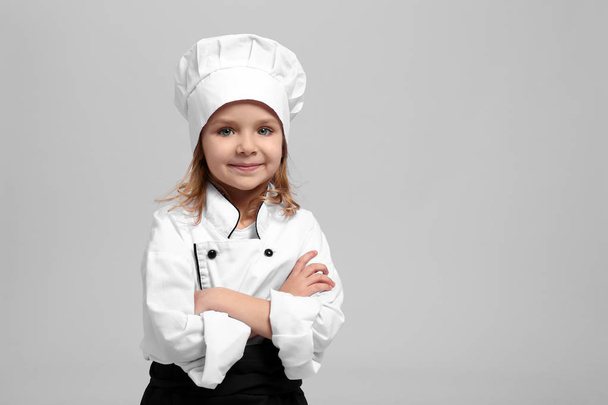 Cute girl in chef uniform  - Valokuva, kuva