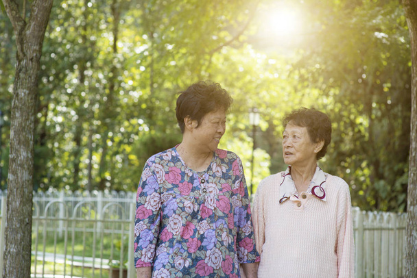 Asian elderly women morning exercise, walking at outdoor - Zdjęcie, obraz