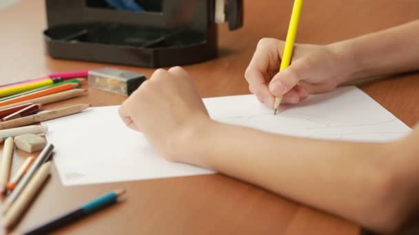 The child draws with pencils. close-up - Felvétel, videó