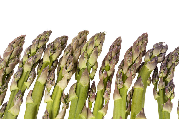 Heap of green asparagus  vegetables isolated on white background - Photo, image