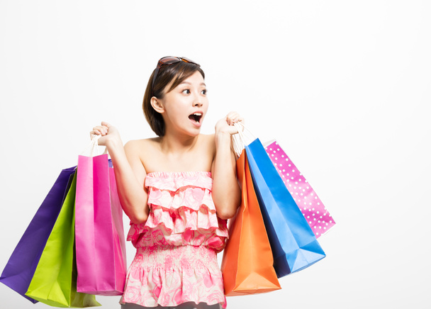 young happy smiling woman with shopping bags - Фото, изображение