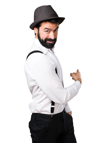 Hipster man with beard pointing back - Fotoğraf, Görsel