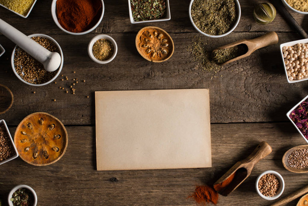 Various colorful spices on wooden table. Place for typography and logo - Valokuva, kuva