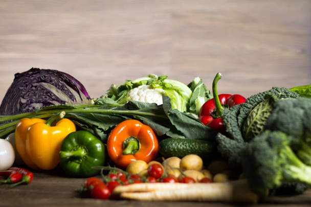 Healthy food and ingredients on rustic wooden background, Fresh vegetables on the wooden surface - Foto, imagen
