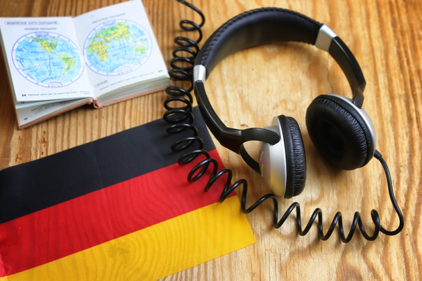 course language headphone and flag on a table - Photo, Image