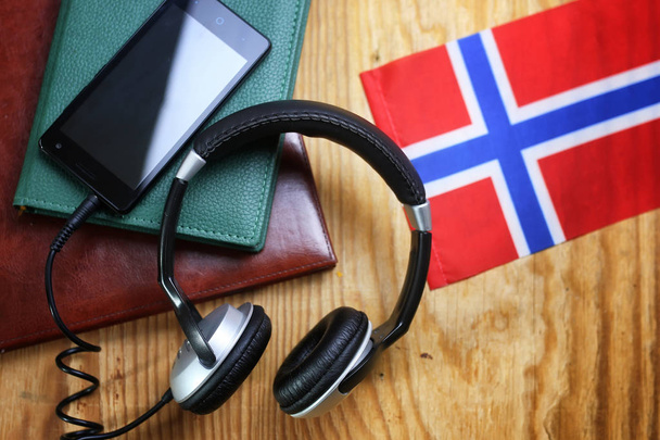 headphones and flag on a wooden background - Photo, Image