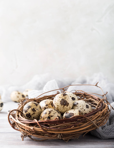 Easter composition of quail eggs in the nest - Фото, изображение