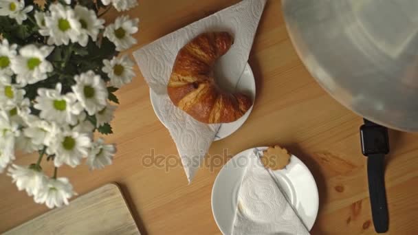 Breakfast With Coffee, Croissant And A Smart Watch. Top View. Dolly. - Záběry, video