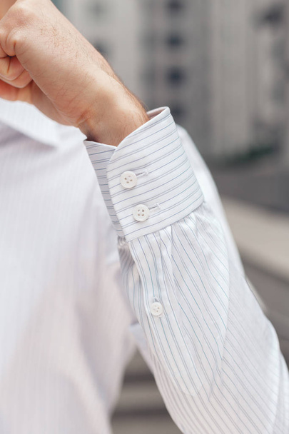 Close up of a businessman showing a shirt cuff - Foto, Imagem