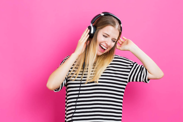 Happy young woman with headphones - Foto, imagen