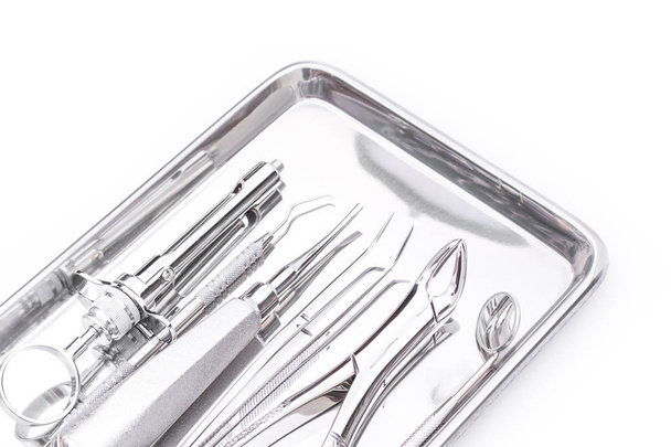 Dental tools and equipment on white background - Fotografie, Obrázek