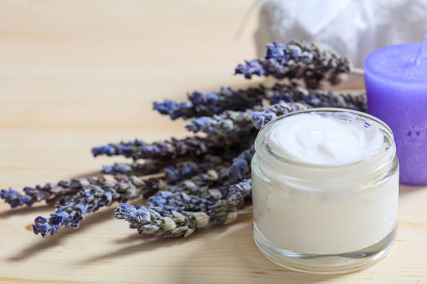Moisturizing cream and lavender on wooden background - Photo, Image