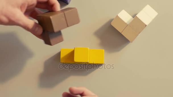 Mans hand picking 3D tetris - Metraje, vídeo