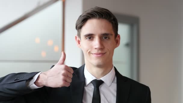 Thumbs Up by Young Businessman in Office - Felvétel, videó