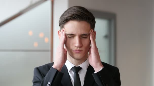 Headache, Tense Young Businessman in Office - Materiał filmowy, wideo