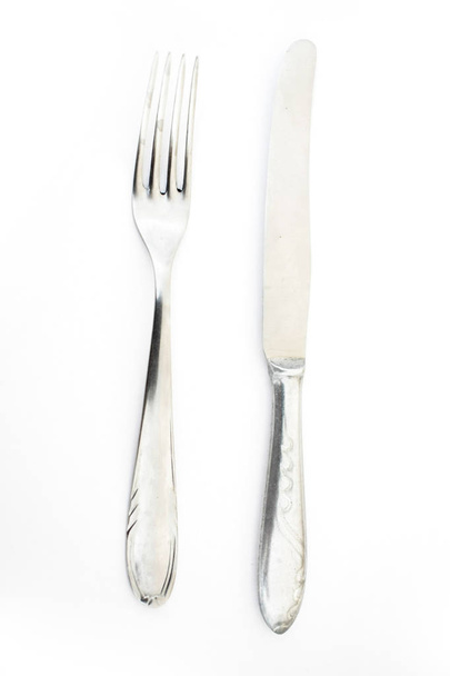 metallic steel fork and knife isolated on white background - Fotoğraf, Görsel