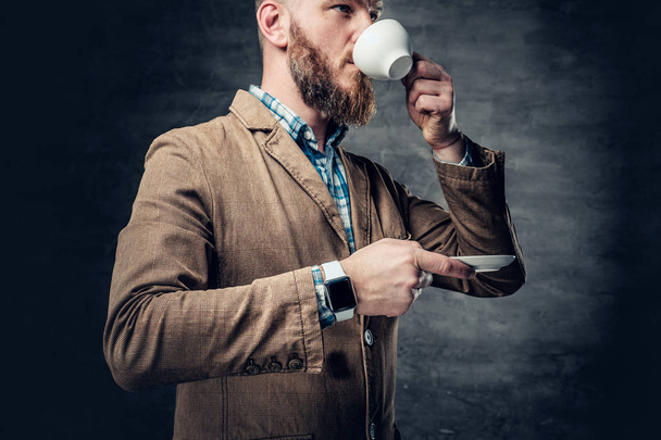 Bearded hipster male drinks coffee. - Photo, Image