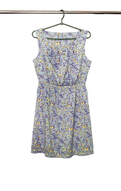 Summer dress with a butterfly pattern hanging on a hanger, isolated. - Photo, Image
