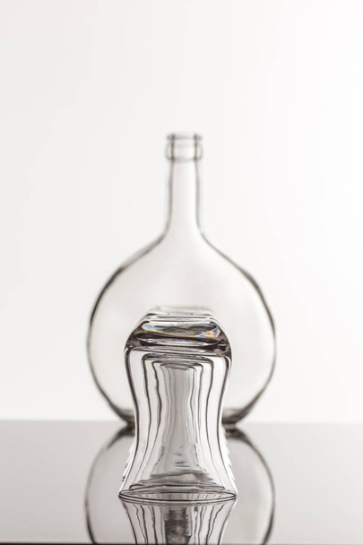 Empty transparent bottle and glass - Fotografie, Obrázek
