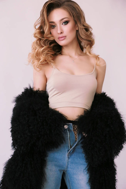 beautiful young girl with blond curly hair and glowing skin  - Zdjęcie, obraz