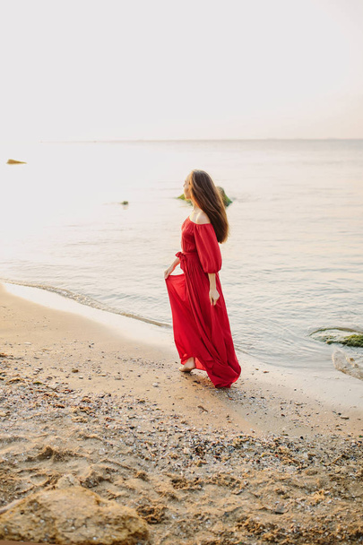 Beautiful young girl in red dress - Foto, Imagen
